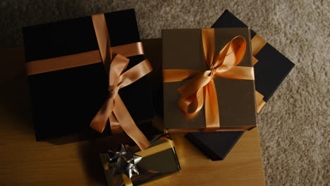 Overhead-Shot-Of-Gifts-Or-Presents-Wrapped-On-Table-At-Home-3